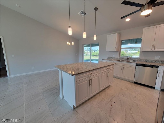 kitchen featuring white cabinetry, stainless steel dishwasher, a kitchen island, and sink