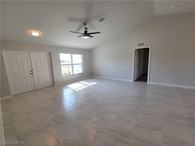 spare room with ceiling fan and vaulted ceiling