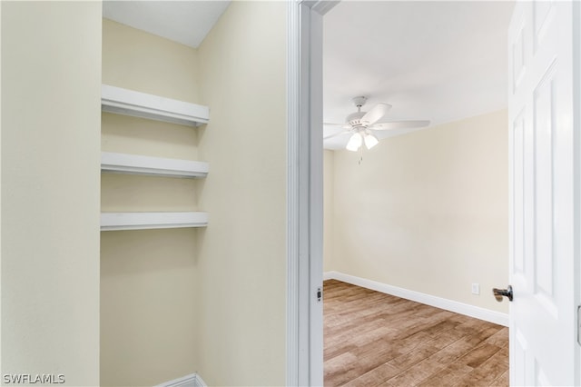 spare room featuring ceiling fan and light wood-type flooring