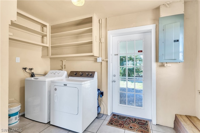 clothes washing area featuring washing machine and dryer and light tile floors