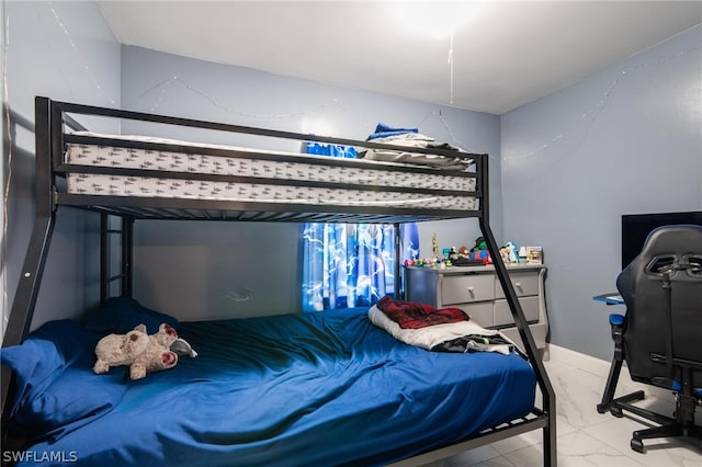 bedroom with light tile patterned floors