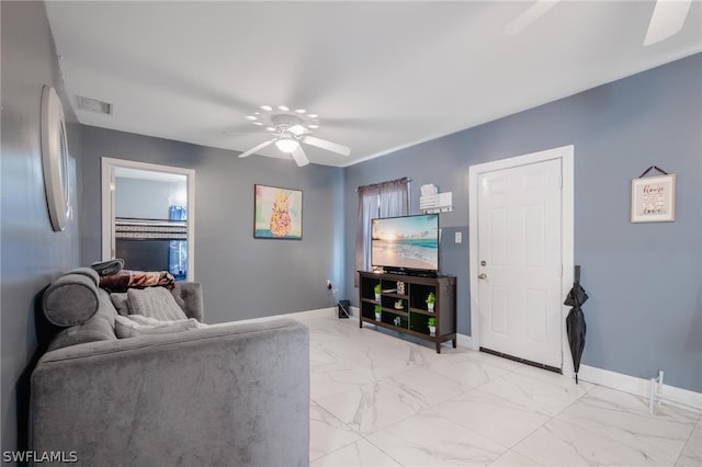 living room featuring ceiling fan and light tile patterned floors