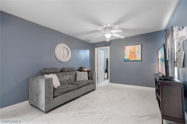 living room with ceiling fan and light tile patterned floors