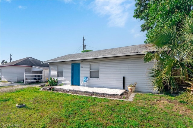 back of house with a yard