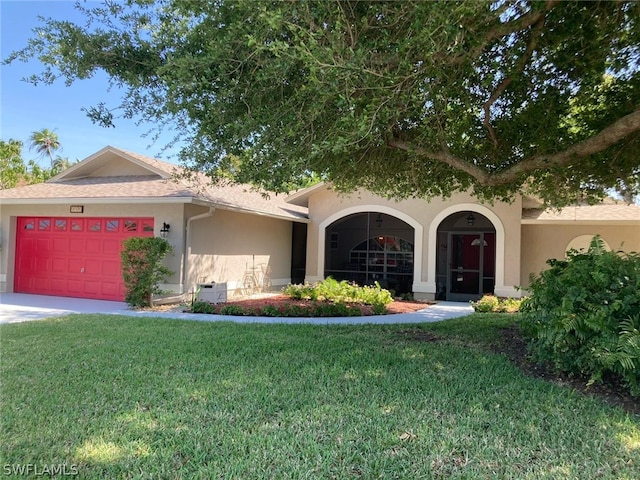 view of front facade with a garage and a front yard