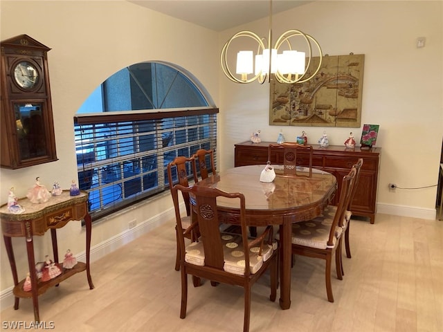 dining area featuring a chandelier and light hardwood / wood-style floors