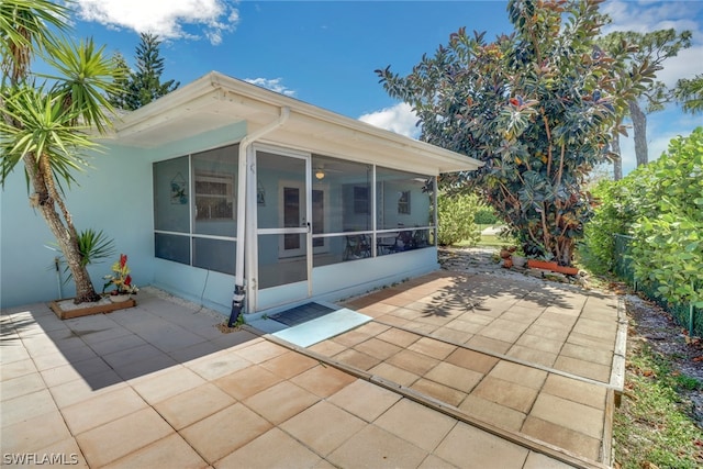 exterior space with a sunroom