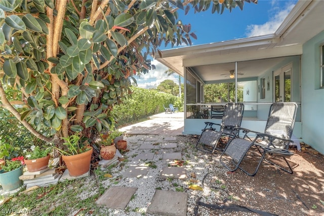 view of patio featuring ceiling fan