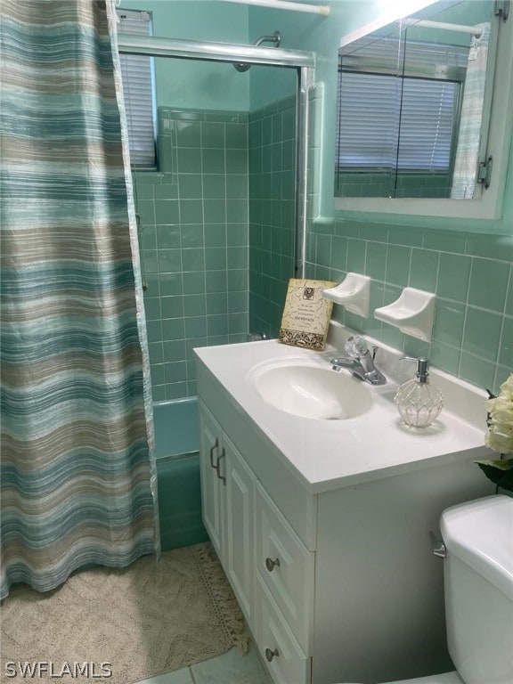 full bathroom with tile walls, shower / bathtub combination with curtain, toilet, tasteful backsplash, and vanity