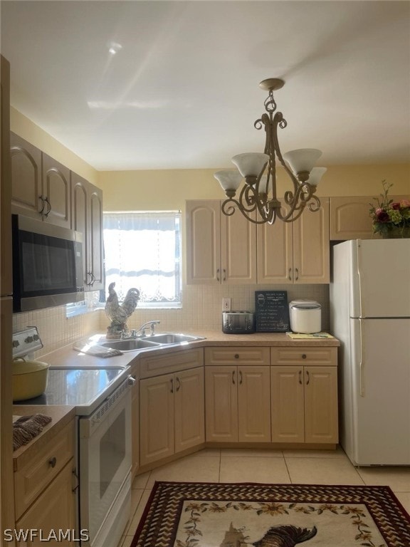 kitchen featuring white appliances, tasteful backsplash, light tile floors, and pendant lighting