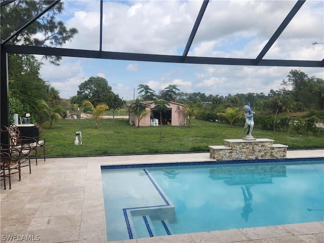 view of swimming pool featuring a patio, glass enclosure, and a shed