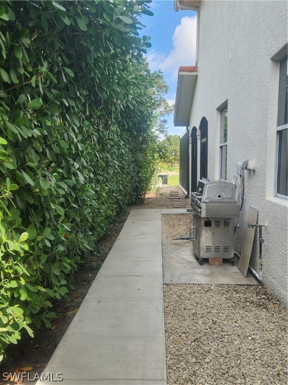 view of property exterior featuring a patio area