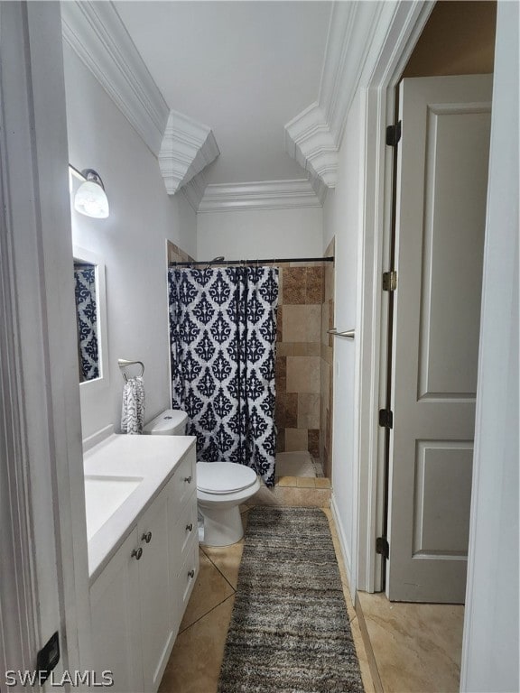 bathroom featuring tile patterned floors, walk in shower, ornamental molding, vanity, and toilet