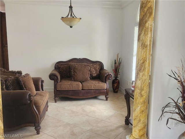 sitting room with crown molding and light tile patterned flooring