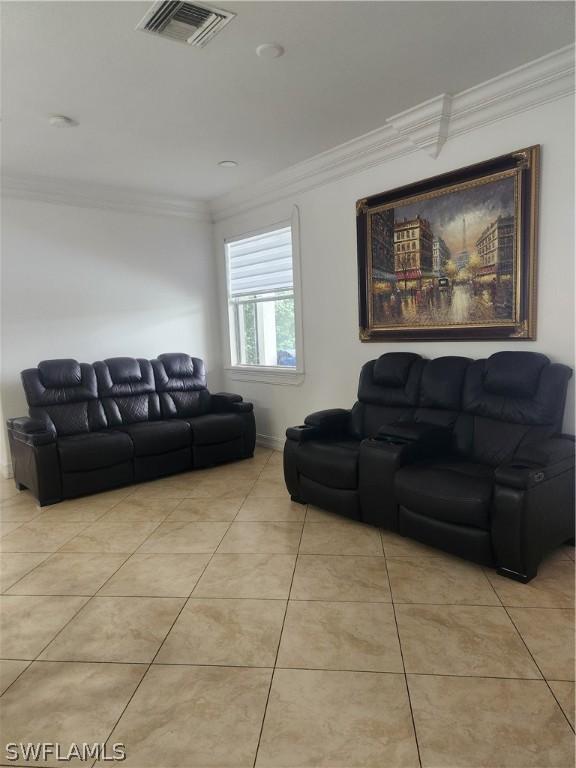 tiled living room with crown molding