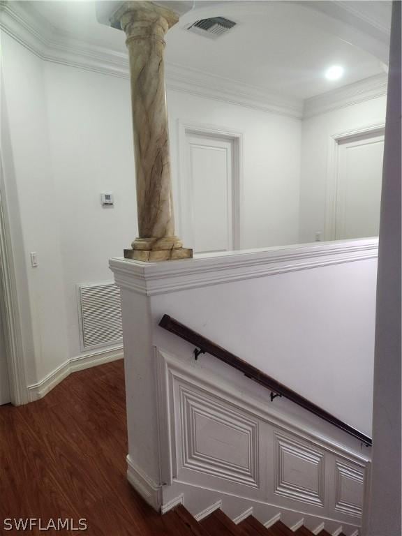 hallway featuring dark hardwood / wood-style floors and crown molding