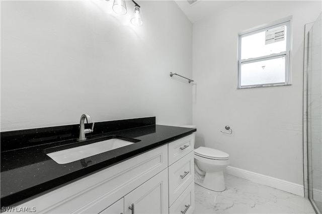 bathroom featuring tile floors, vanity, and toilet