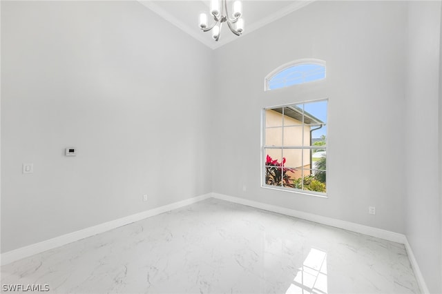 spare room with a towering ceiling, a notable chandelier, and light tile floors