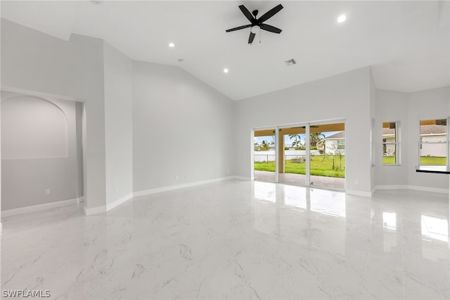 tiled empty room featuring high vaulted ceiling and ceiling fan