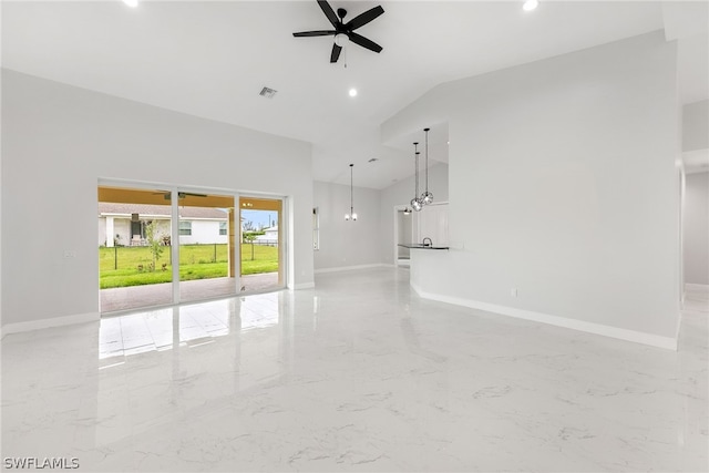 tiled spare room featuring vaulted ceiling and ceiling fan