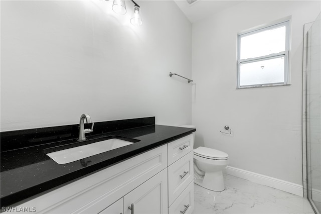 bathroom featuring toilet, tile floors, and vanity