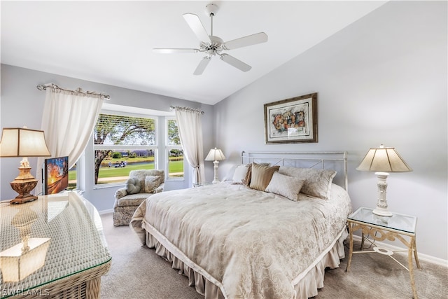 bedroom with light carpet, ceiling fan, and vaulted ceiling