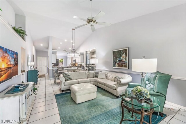 living room featuring high vaulted ceiling, ceiling fan, and light tile floors