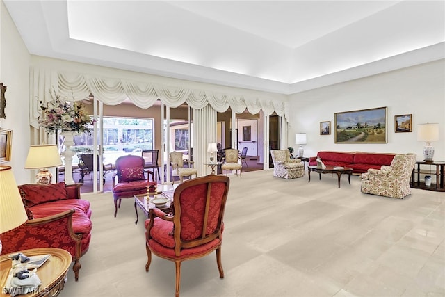 living room featuring a tray ceiling