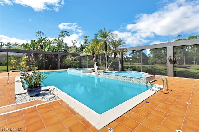 view of pool featuring an in ground hot tub and a patio area