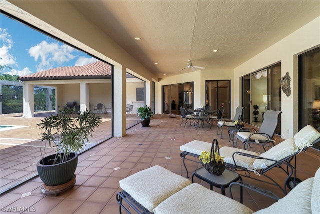 view of patio / terrace with an outdoor living space and ceiling fan