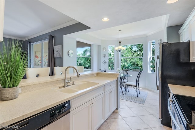 kitchen featuring white cabinetry, sink, dishwasher, pendant lighting, and a chandelier