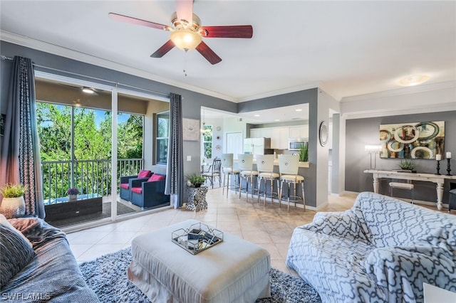 tiled living room featuring ceiling fan and crown molding