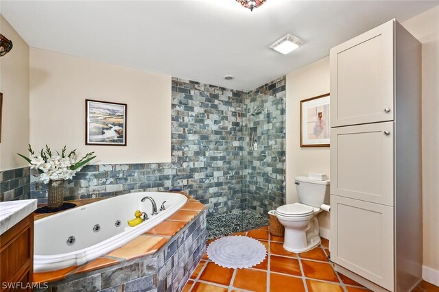 bathroom with tile patterned flooring, toilet, vanity, tiled shower, and a whirlpool tub