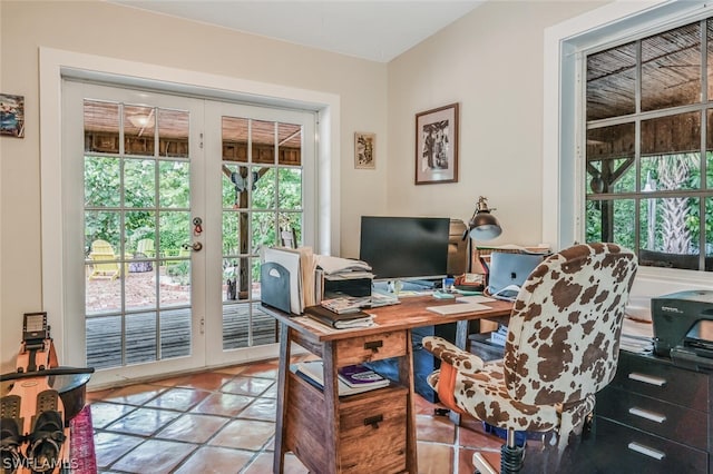 home office with light tile patterned floors and french doors