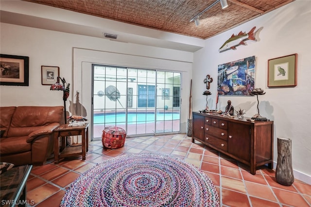 interior space featuring light tile patterned floors and visible vents