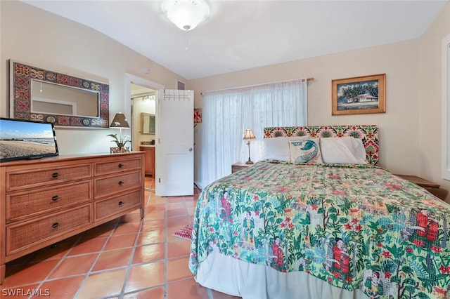 bedroom featuring light tile patterned floors and visible vents