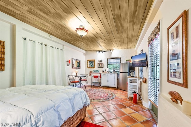 tiled bedroom featuring wooden ceiling and freestanding refrigerator