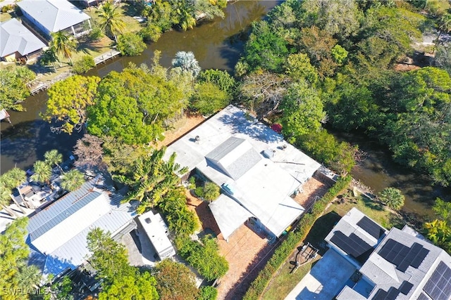 drone / aerial view featuring a water view and a residential view