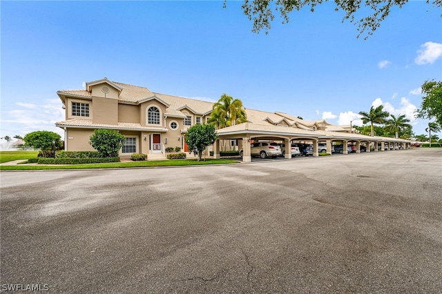 view of front of home with a carport