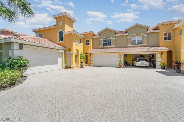 mediterranean / spanish-style home featuring a garage