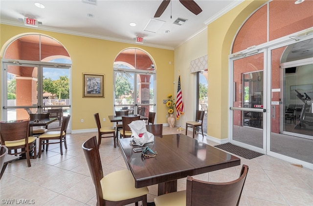 dining area featuring ornamental molding, ceiling fan, and light tile flooring