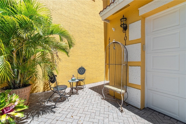 doorway to property with a patio