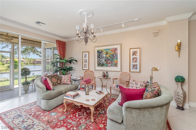 tiled living room featuring rail lighting, a water view, a chandelier, and ornamental molding