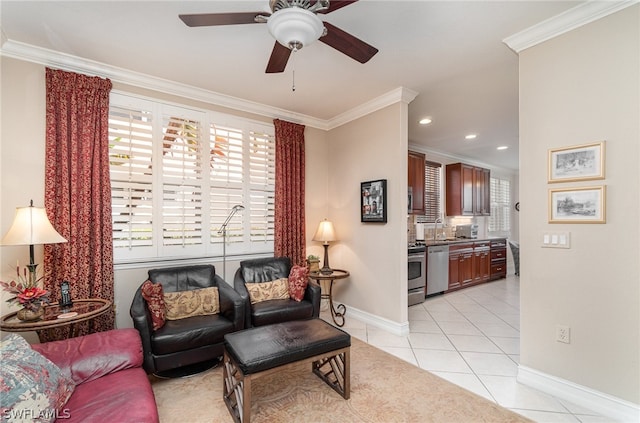 living room featuring sink, ceiling fan, light tile floors, and ornamental molding