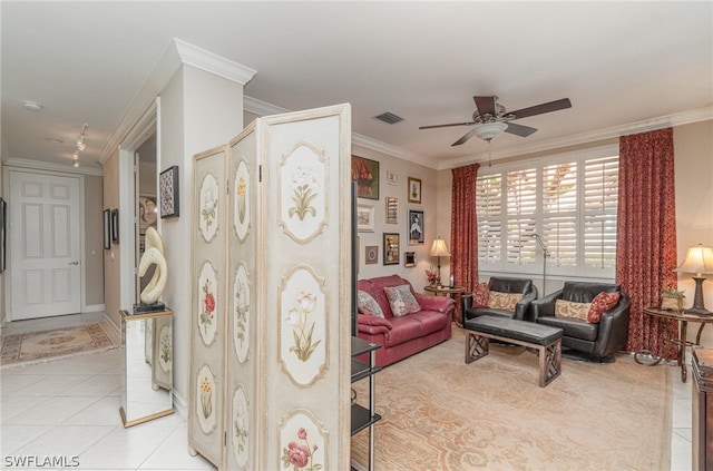 tiled living room featuring ceiling fan and ornamental molding