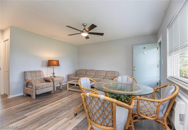 dining room featuring ceiling fan and hardwood / wood-style flooring