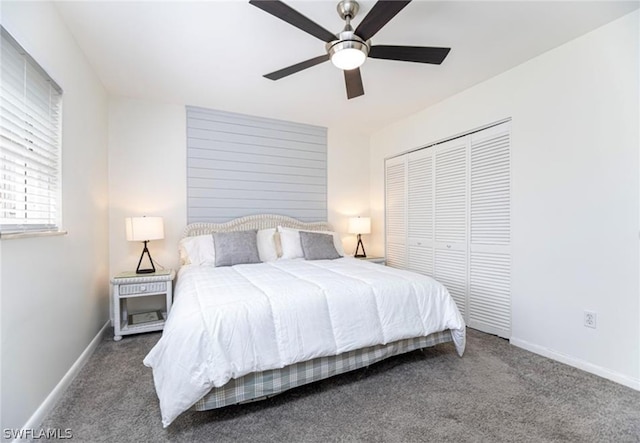 bedroom with a closet, ceiling fan, and dark colored carpet