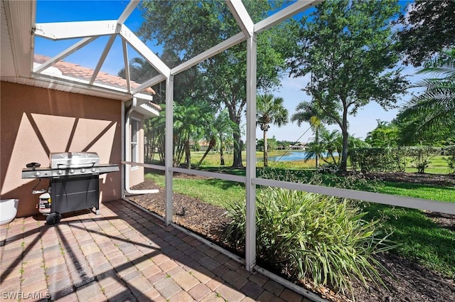 unfurnished sunroom with a water view