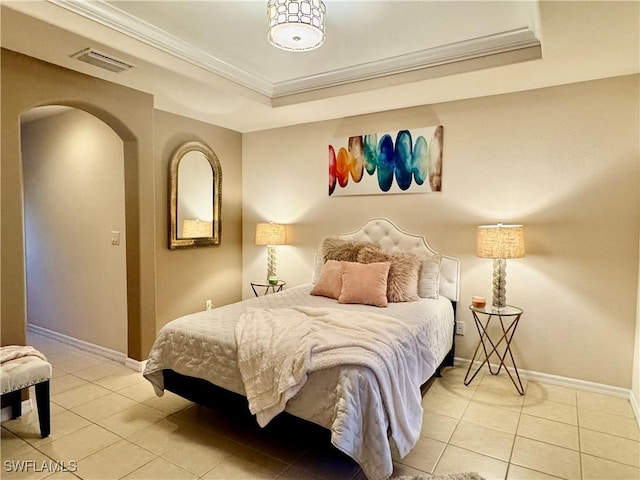 bedroom featuring a raised ceiling, light tile patterned floors, and crown molding