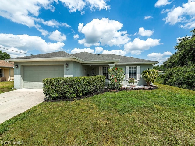 single story home featuring a garage and a front lawn